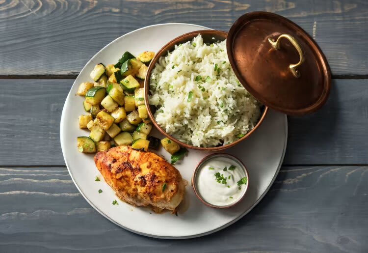 Yogurt-Marinated Chicken with Rice Pilaf, Roasted Zucchini, and Cilantro